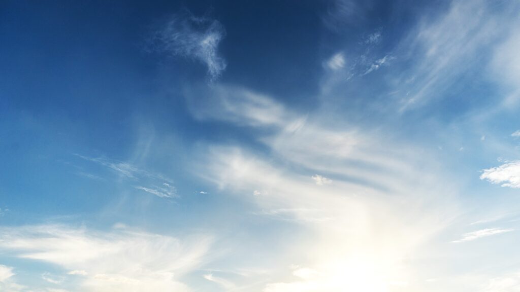 An image of a blue sky with white clouds.