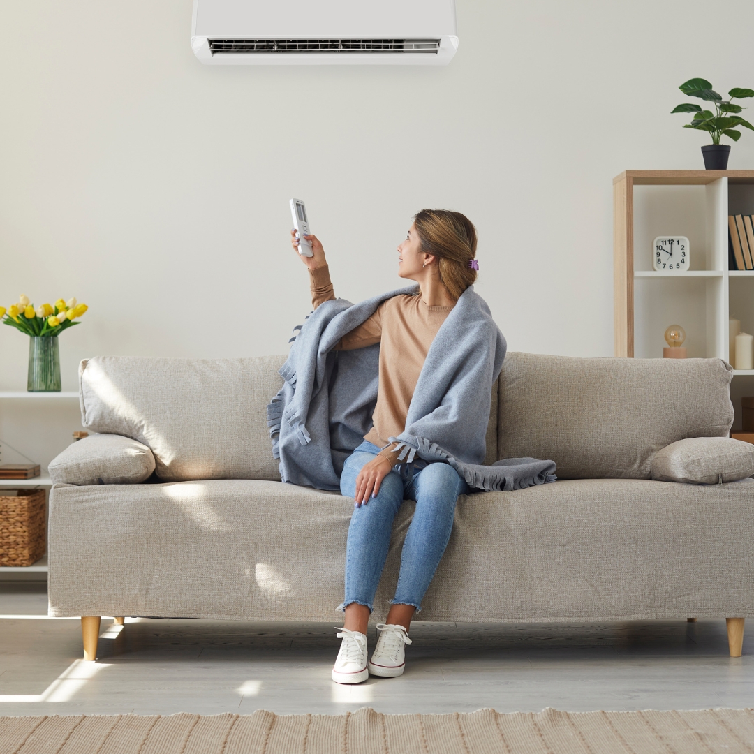 woman adjusting fan speed