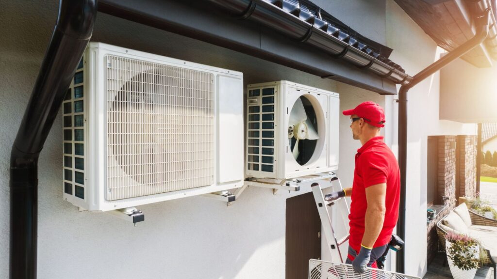 HVAC technician servicing HVAC system