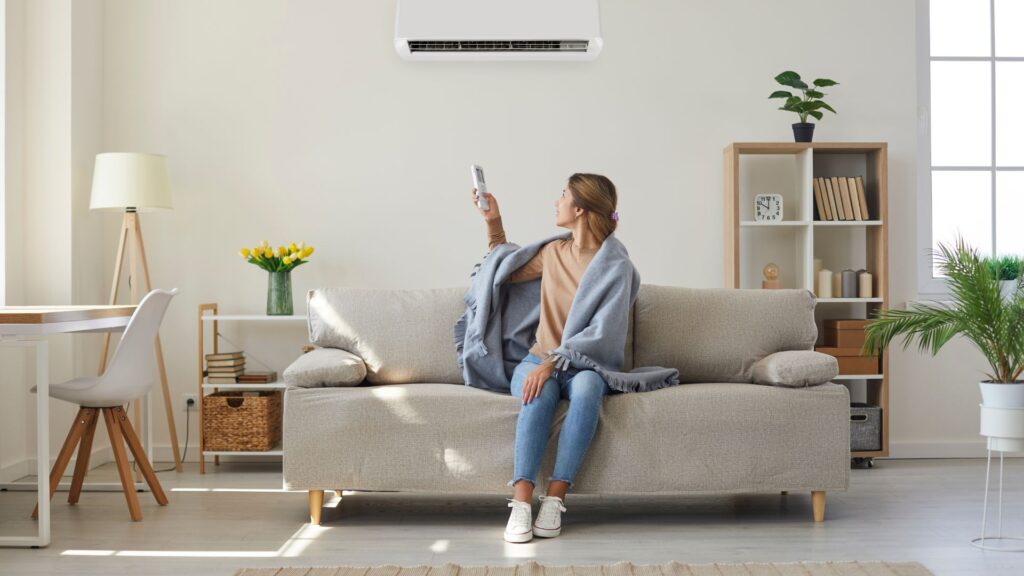 a woman turning on their AC