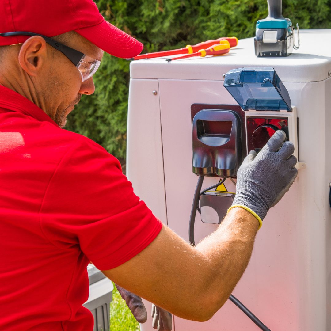 man working on an AC unit